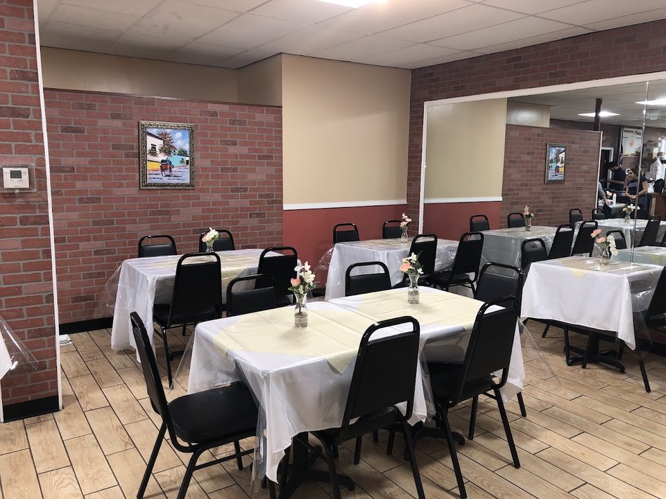 Casual Spanish restaurant dining room with table service.
